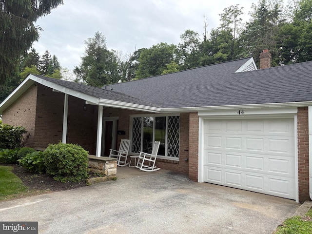 44 S Brookside Rd, Springfield, PA 19064 - single story home with brick siding, a shingled roof, a garage, and driveway