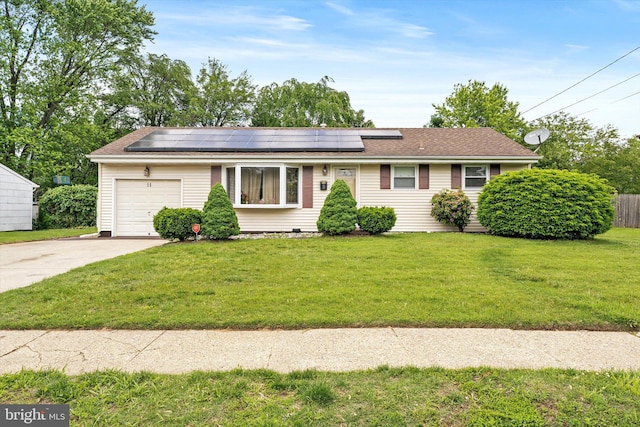 11 Langdon Rd, Burlington, NJ 08016 - single story home featuring driveway, an attached garage, solar panels, a front yard, and a shingled roof
