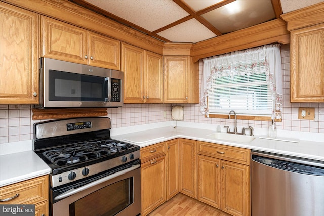 11 Langdon Rd, Burlington, NJ 08016 - kitchen featuring appliances with stainless steel finishes, a sink, light countertops, and backsplash
