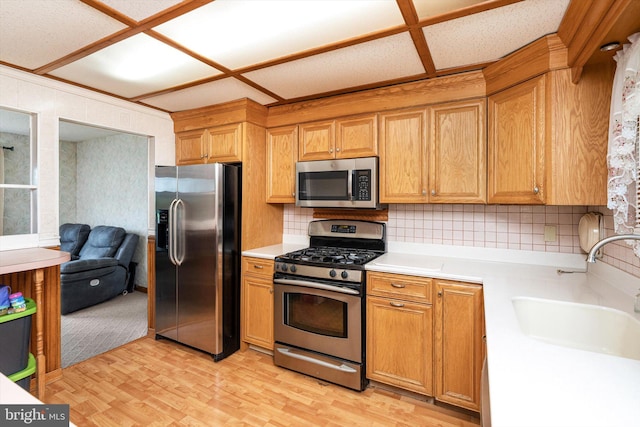 11 Langdon Rd, Burlington, NJ 08016 - kitchen with appliances with stainless steel finishes, light countertops, a sink, and decorative backsplash
