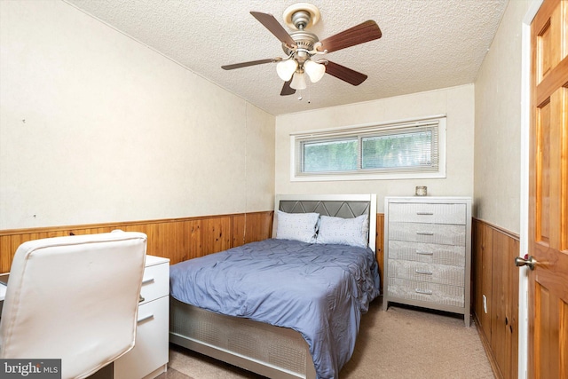 11 Langdon Rd, Burlington, NJ 08016 - bedroom featuring a textured ceiling, wood walls, a wainscoted wall, light carpet, and ceiling fan