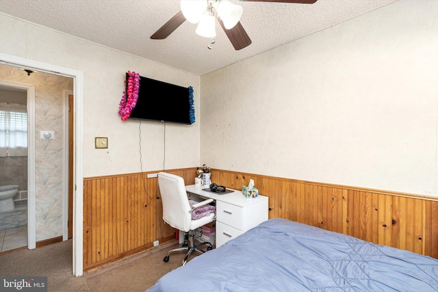 11 Langdon Rd, Burlington, NJ 08016 - carpeted bedroom with a wainscoted wall, wood walls, a textured ceiling, and a ceiling fan