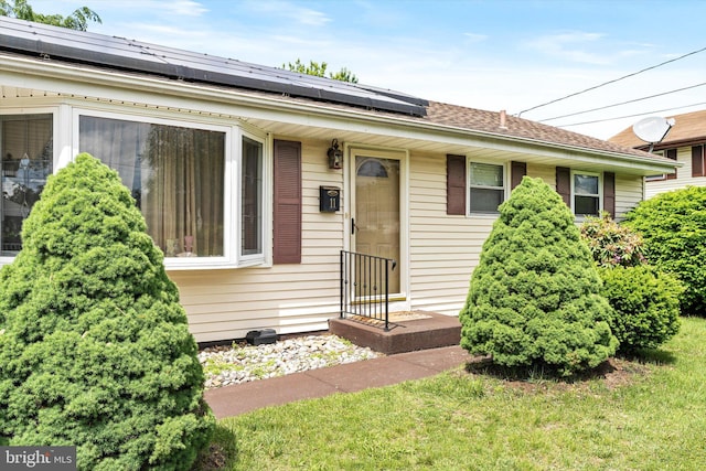11 Langdon Rd, Burlington, NJ 08016 - view of front of home featuring solar panels, a front yard, and a shingled roof