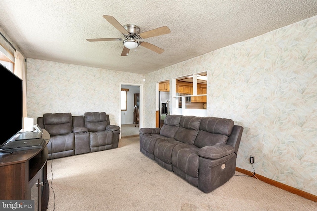 11 Langdon Rd, Burlington, NJ 08016 - living room with wallpapered walls, light colored carpet, a ceiling fan, baseboards, and a textured ceiling