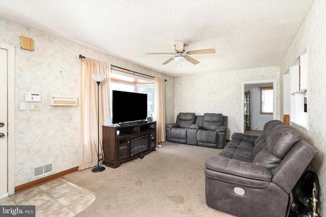 11 Langdon Rd, Burlington, NJ 08016 - living area featuring a textured ceiling, wallpapered walls, a ceiling fan, carpet, and baseboards