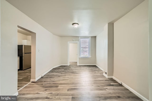118 N Hilton St, Baltimore, MD 21229 - unfurnished room featuring wood finished floors and baseboards