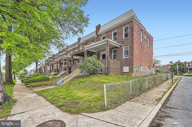 118 N Hilton St, Baltimore, MD 21229 - view of side of property with brick siding and a chimney