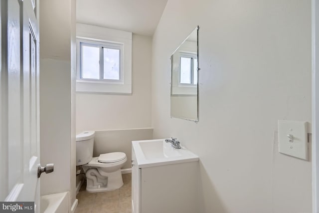 118 N Hilton St, Baltimore, MD 21229 - full bathroom with vanity, toilet, tile patterned flooring, and a tub to relax in