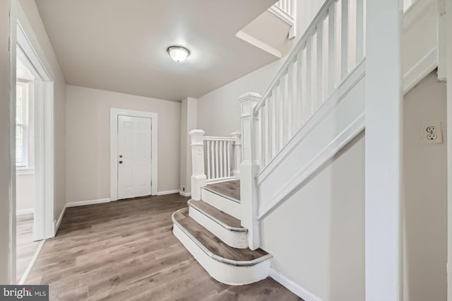 118 N Hilton St, Baltimore, MD 21229 - entrance foyer featuring stairway, wood finished floors, and baseboards