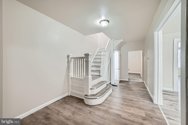 118 N Hilton St, Baltimore, MD 21229 - staircase with wood finished floors and baseboards