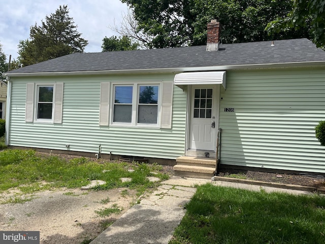 1208 First Ave, Seabrook, NJ 08302 - view of front facade featuring a chimney, roof with shingles, and entry steps