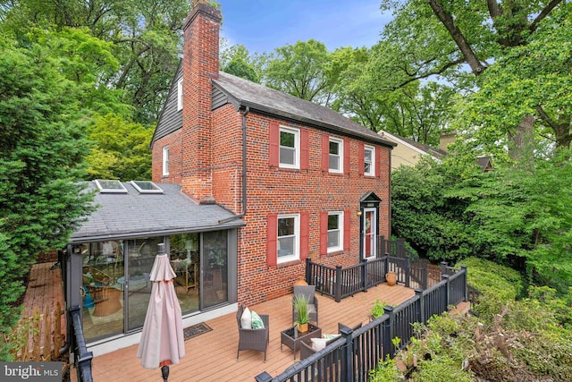 8404 Galveston Rd, Silver Spring, MD 20910 - rear view of house with a chimney, brick siding, and a wooden deck