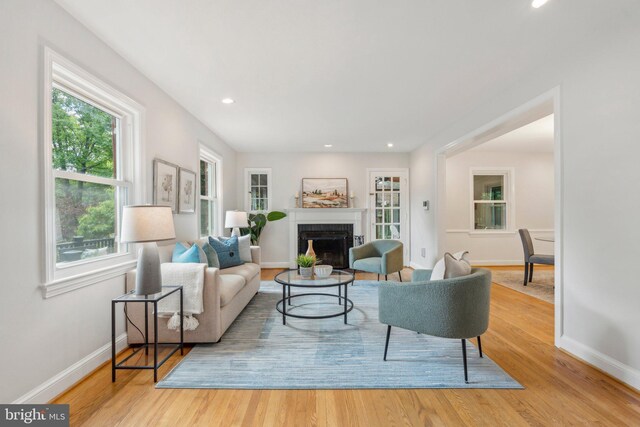 8404 Galveston Rd, Silver Spring, MD 20910 - living room featuring a fireplace, baseboards, wood finished floors, and recessed lighting