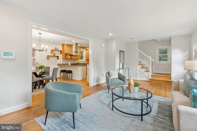 8404 Galveston Rd, Silver Spring, MD 20910 - living room featuring light wood-style floors, stairs, baseboards, recessed lighting, and a chandelier