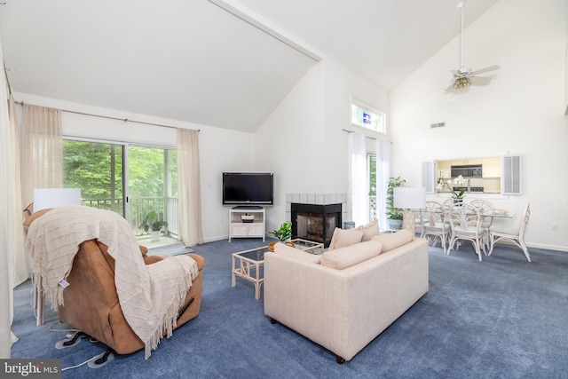 33340 Timberview Ct Unit 21003, Bethany Beach, DE 19930 - living area with high vaulted ceiling, healthy amount of natural light, a tiled fireplace, and carpet