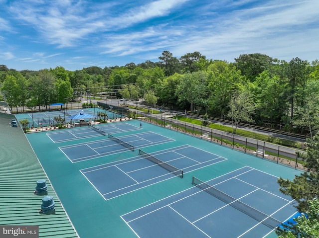 33340 Timberview Ct Unit 21003, Bethany Beach, DE 19930 - view of tennis court featuring a view of trees
