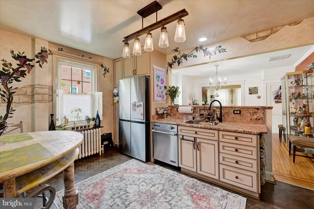 4224 Evans Chapel Rd, Baltimore, MD 21211 - kitchen with stainless steel appliances, a sink, a peninsula, radiator heating unit, and light stone countertops