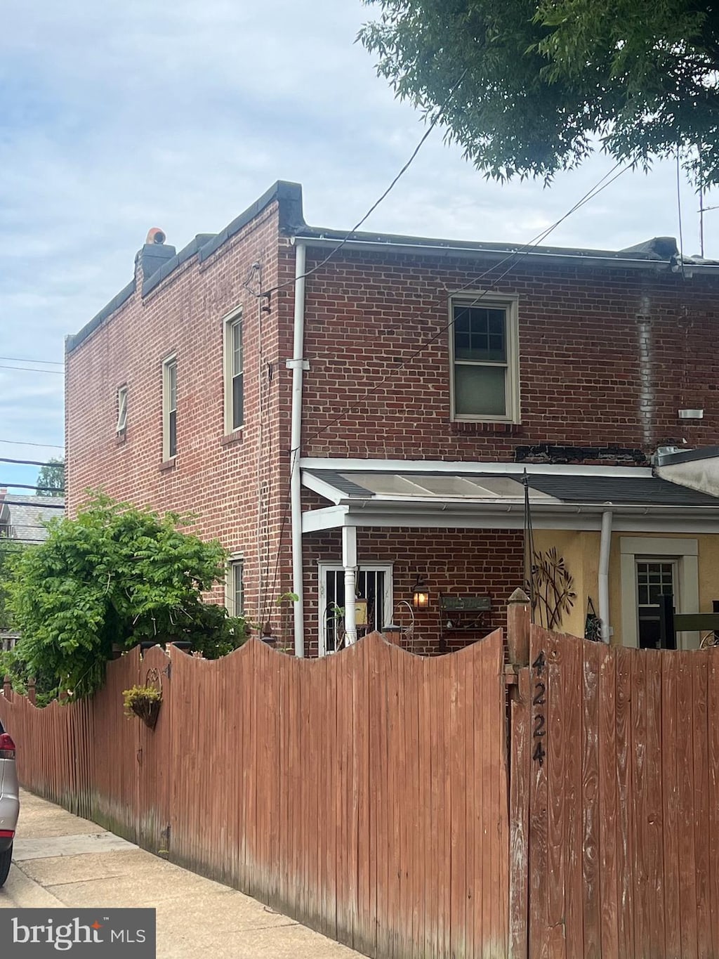 4224 Evans Chapel Rd, Baltimore, MD 21211 - view of home's exterior with brick siding and a gate