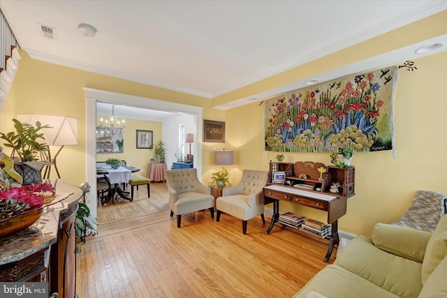 4224 Evans Chapel Rd, Baltimore, MD 21211 - living area with a chandelier, light wood finished floors, and crown molding