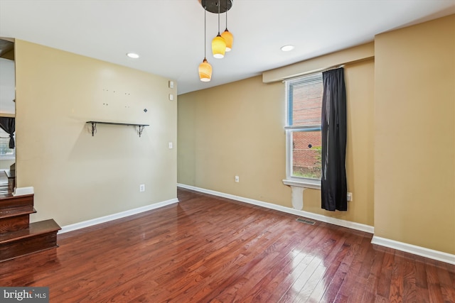 3603 6th St, Baltimore, MD 21225 - empty room with wood finished floors, baseboards, and recessed lighting
