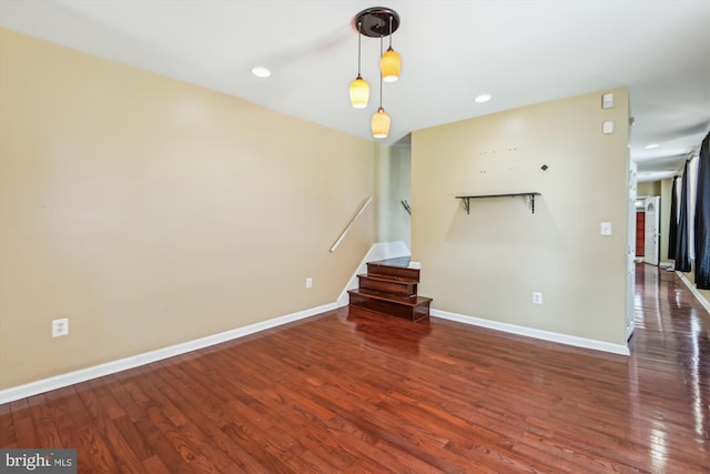 3603 6th St, Baltimore, MD 21225 - spare room featuring wood finished floors, baseboards, stairs, and recessed lighting
