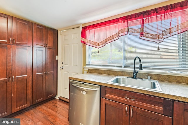 3603 6th St, Baltimore, MD 21225 - kitchen featuring dishwasher, a sink, dark wood finished floors, and light countertops