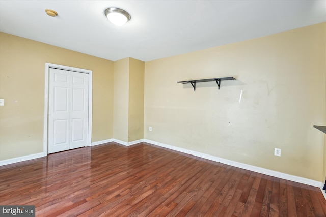 3603 6th St, Baltimore, MD 21225 - unfurnished bedroom with wood finished floors, baseboards, and a closet