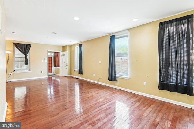 3603 6th St, Baltimore, MD 21225 - empty room with wood finished floors, baseboards, and recessed lighting