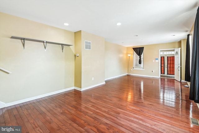 3603 6th St, Baltimore, MD 21225 - unfurnished living room featuring wood finished floors, baseboards, and recessed lighting
