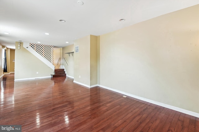 3603 6th St, Baltimore, MD 21225 - empty room with stairs, hardwood / wood-style flooring, baseboards, and recessed lighting