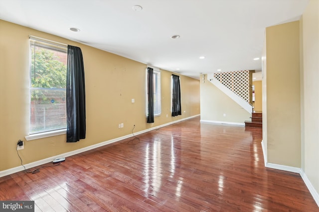 3603 6th St, Baltimore, MD 21225 - spare room with stairway, wood finished floors, baseboards, and recessed lighting