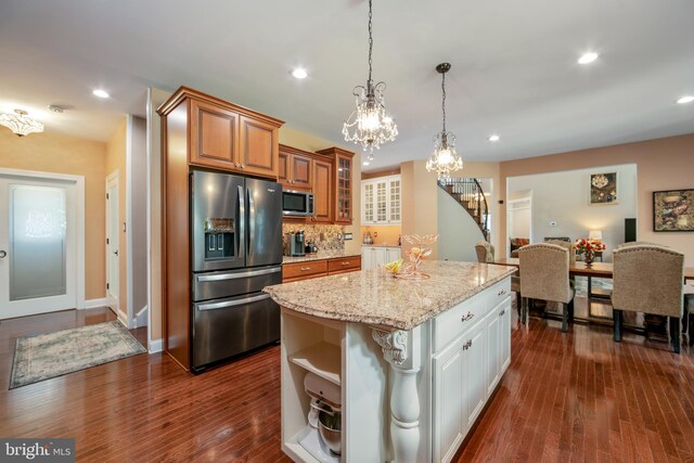 60 Sleepy Hollow Dr, Tabernacle, NJ 08088 - kitchen with stainless steel appliances, a chandelier, open shelves, a center island, and light stone counters