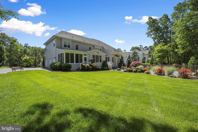 60 Sleepy Hollow Dr, Tabernacle, NJ 08088 - rear view of house with a garage, a sunroom, and asphalt driveway