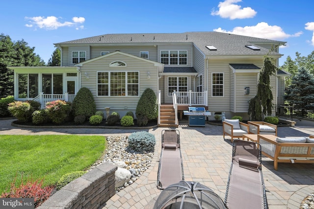 60 Sleepy Hollow Dr, Tabernacle, NJ 08088 - rear view of property featuring a patio, a wooden deck, a sunroom, roof with shingles, and a yard