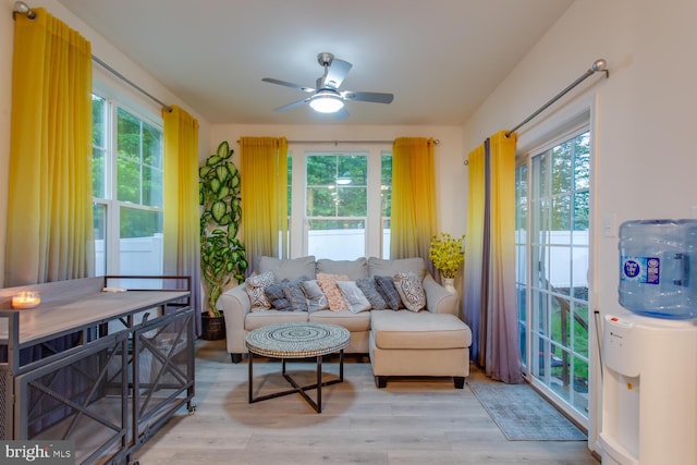 16600 Tortola Dr, Accokeek, MD 20607 - living area featuring healthy amount of natural light, a ceiling fan, and light wood finished floors
