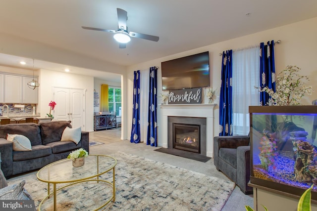 16600 Tortola Dr, Accokeek, MD 20607 - living area featuring light carpet, ceiling fan, a fireplace with flush hearth, and recessed lighting