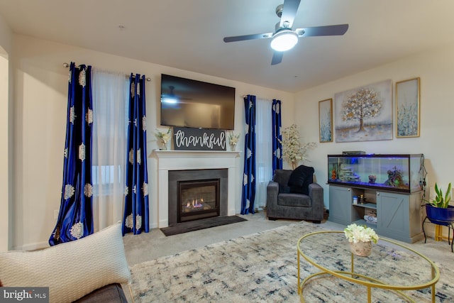 16600 Tortola Dr, Accokeek, MD 20607 - carpeted living room with a fireplace with flush hearth and ceiling fan