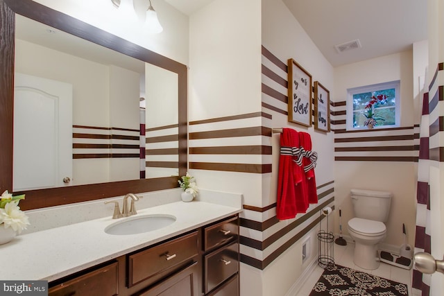16600 Tortola Dr, Accokeek, MD 20607 - bathroom featuring toilet, vanity, and tile patterned floors