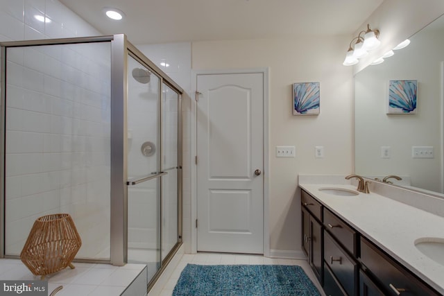 16600 Tortola Dr, Accokeek, MD 20607 - bathroom with a stall shower, double vanity, tile patterned flooring, baseboards, and recessed lighting