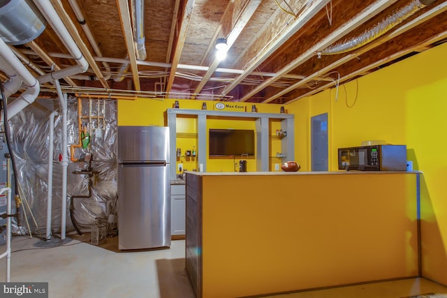 16600 Tortola Dr, Accokeek, MD 20607 - unfinished basement with freestanding refrigerator