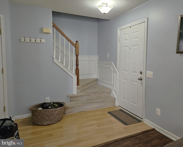 1106 Crestmont Dr, Mantua, NJ 08051 - entrance foyer with stairs, wood finished floors, and wainscoting
