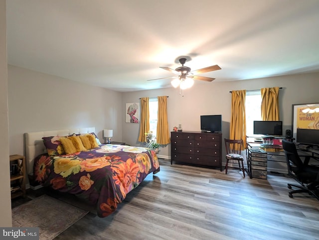 513 Dakemich Ct, Enola, PA 17025 - bedroom featuring multiple windows, wood finished floors, a desk, and a ceiling fan