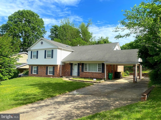 7308 Riverhill Rd, Oxon Hill, MD 20745 - split level home featuring brick siding, a carport, a front lawn, driveway, and roof with shingles