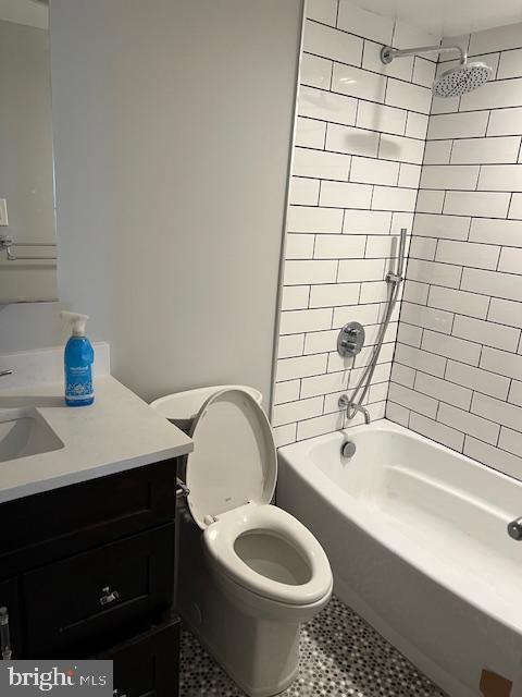 6301 Stevenson Ave Unit 604, Alexandria, VA 22304 - full bathroom with vanity, washtub / shower combination, tile patterned floors, and toilet