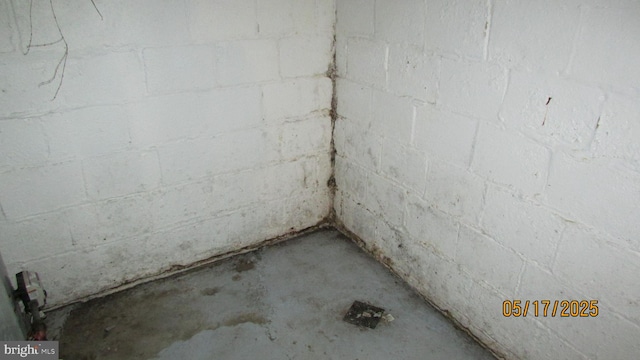 5901 Taylor Rd, Riverdale, MD 20737 - bathroom featuring unfinished concrete flooring and concrete block wall