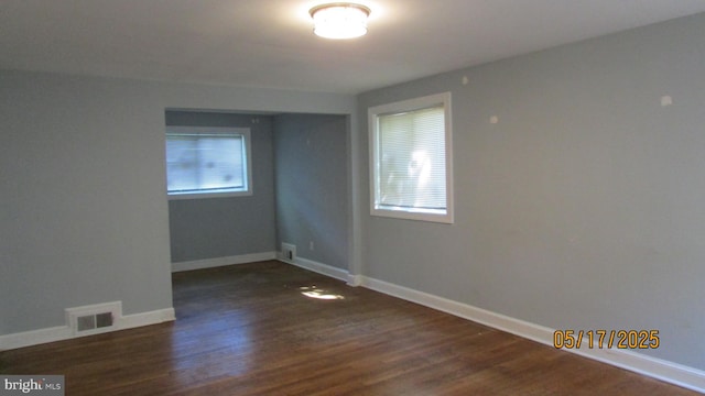 5901 Taylor Rd, Riverdale, MD 20737 - spare room with plenty of natural light, wood finished floors, and baseboards