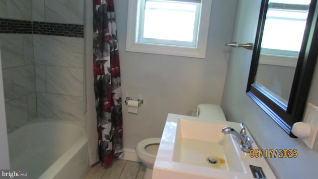 5901 Taylor Rd, Riverdale, MD 20737 - bathroom with toilet, plenty of natural light, a sink, and shower / bathtub combination with curtain