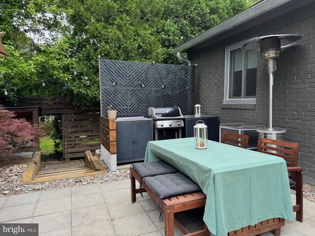5929 Onondaga Rd, Bethesda, MD 20816 - view of patio with a grill and outdoor dining area