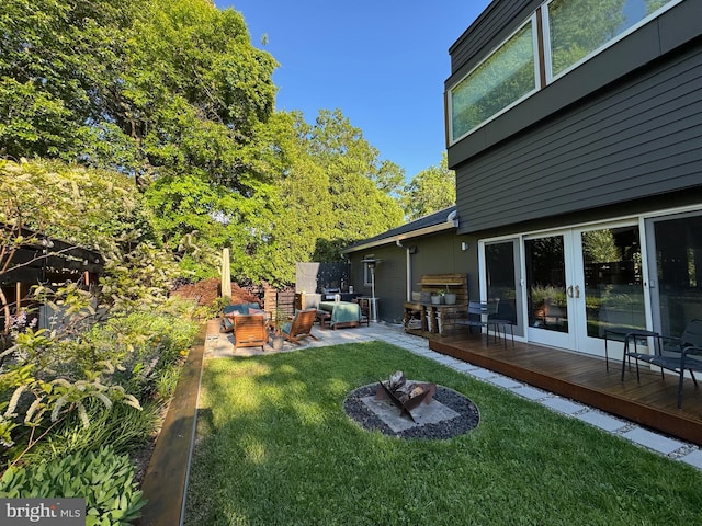 5929 Onondaga Rd, Bethesda, MD 20816 - view of grassy yard featuring a deck and french doors