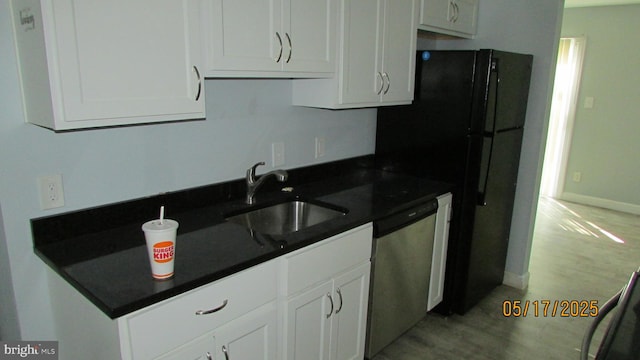 4102 Parkwood Ct, Brentwood, MD 20722 - kitchen featuring a sink, stainless steel dishwasher, white cabinetry, and dark countertops